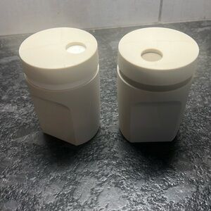 SALT & PEPPER shakers by Tupperware. These appear brand new. Turn lid to…